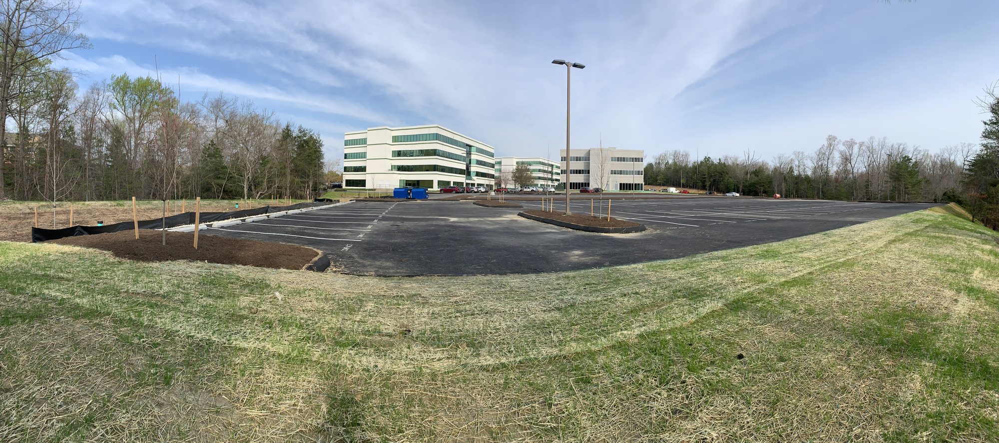 Newly paved drive and parking areas leading to the completed building