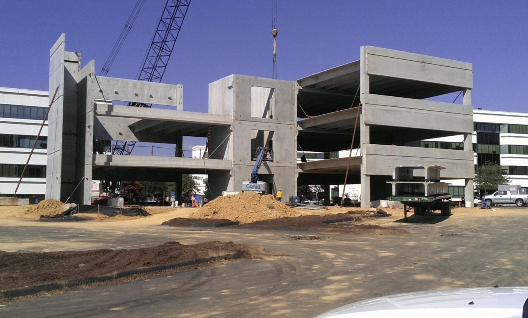 Partially assembled multi-story precast concrete building frame