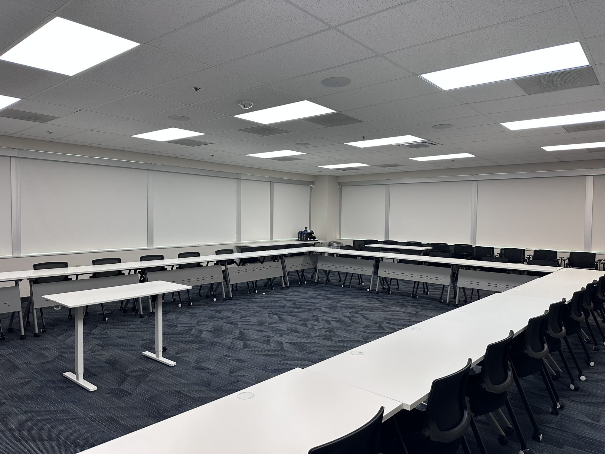 Completed training room with tables arranged around an open floor